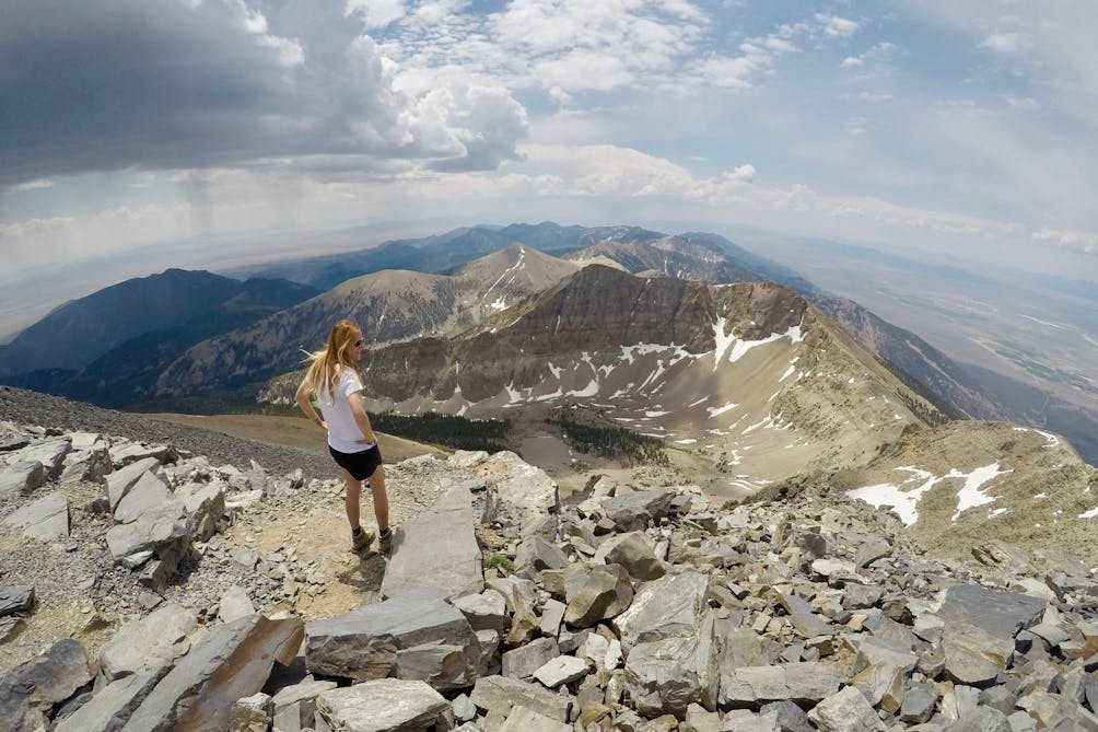 Hiker at the summit of Wheeler Peak in Great Basin National Park Nevada 