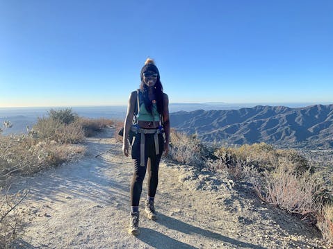woman standing at the peak of Mount Lukens in Los Angeles