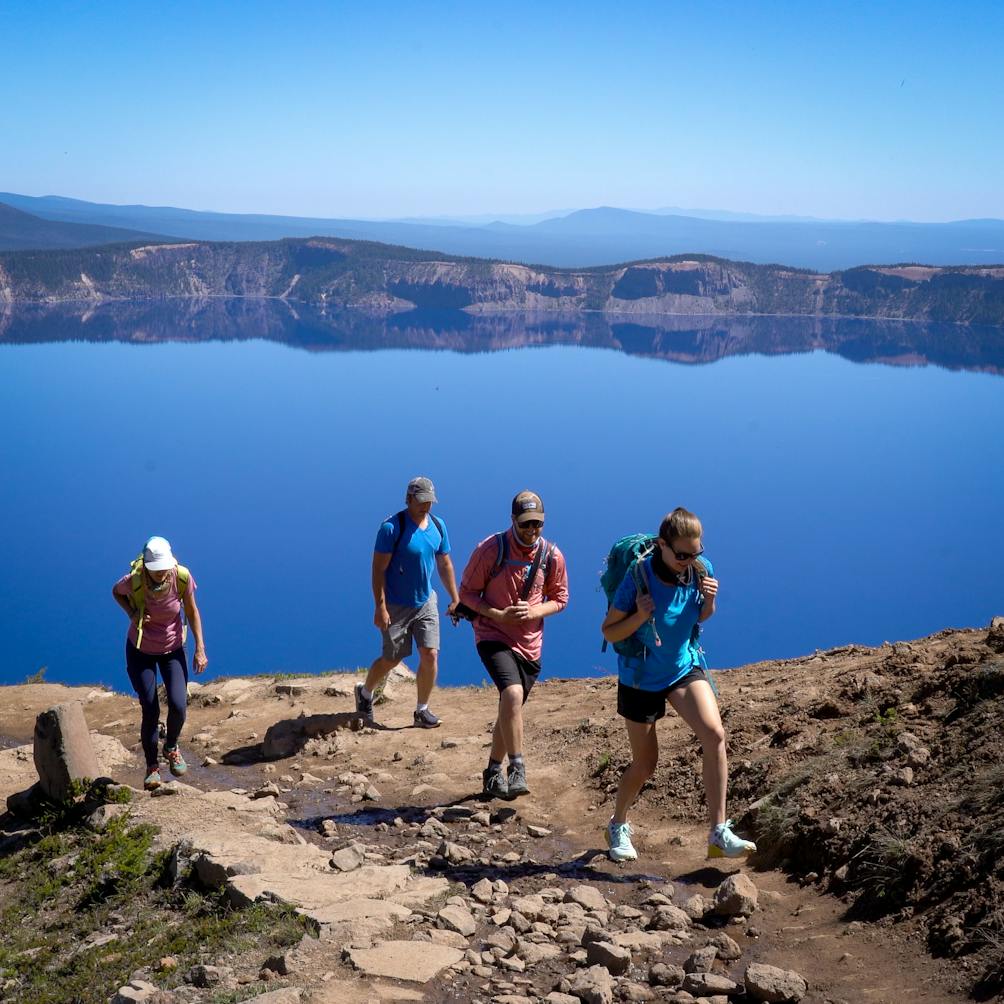 Hikers heading up the trail to Garfield Peak in Crater Lake National Park Oregon 