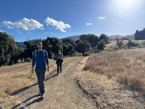 Two hikers at Bear Creek Redwoods Regional Preserve on a new trail. 