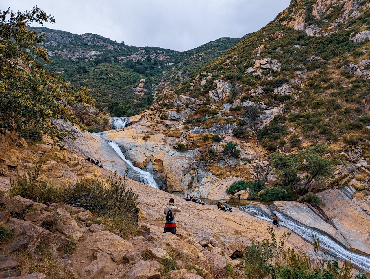 Hiker standing and looking at the Three Sisters Falls in Cleveland National Forest San Diego County 