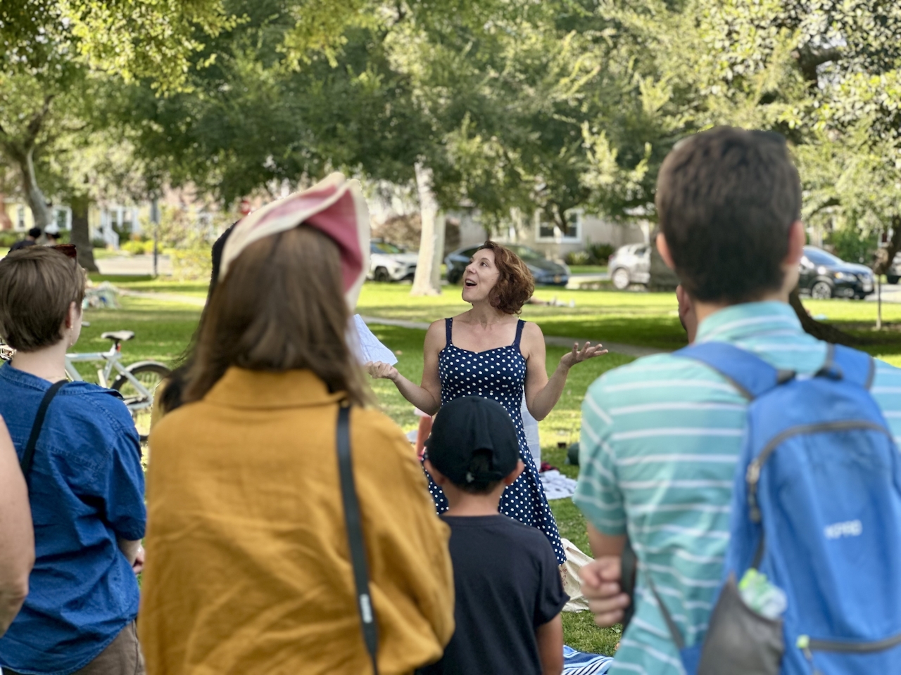 People gathered around a tree at an LA Park as part of the Tree Tour led by Stephanie Carrie