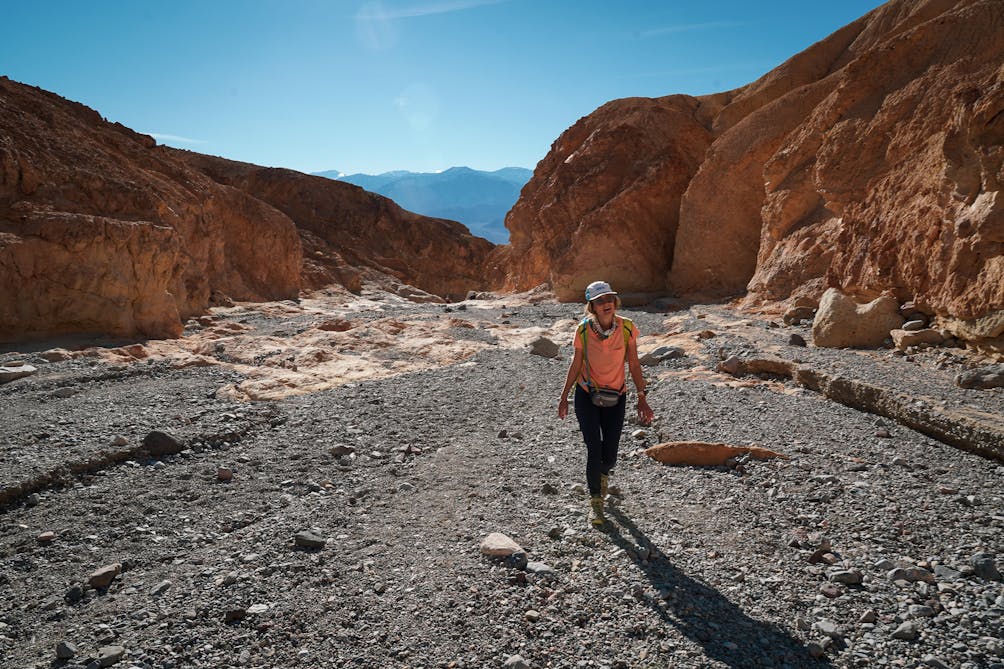 Woman hiking in Gower Gulch in Golden Canyon in Death Valley National Park 