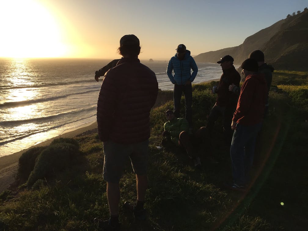 Group of friends at the beach at sunset near Wildcat Camp in Point Reyes National Seashore 