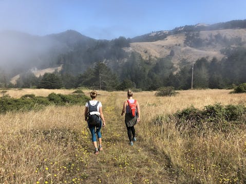 Two women hiking a trail at Jenner Headlands on the Sonoma Coast 