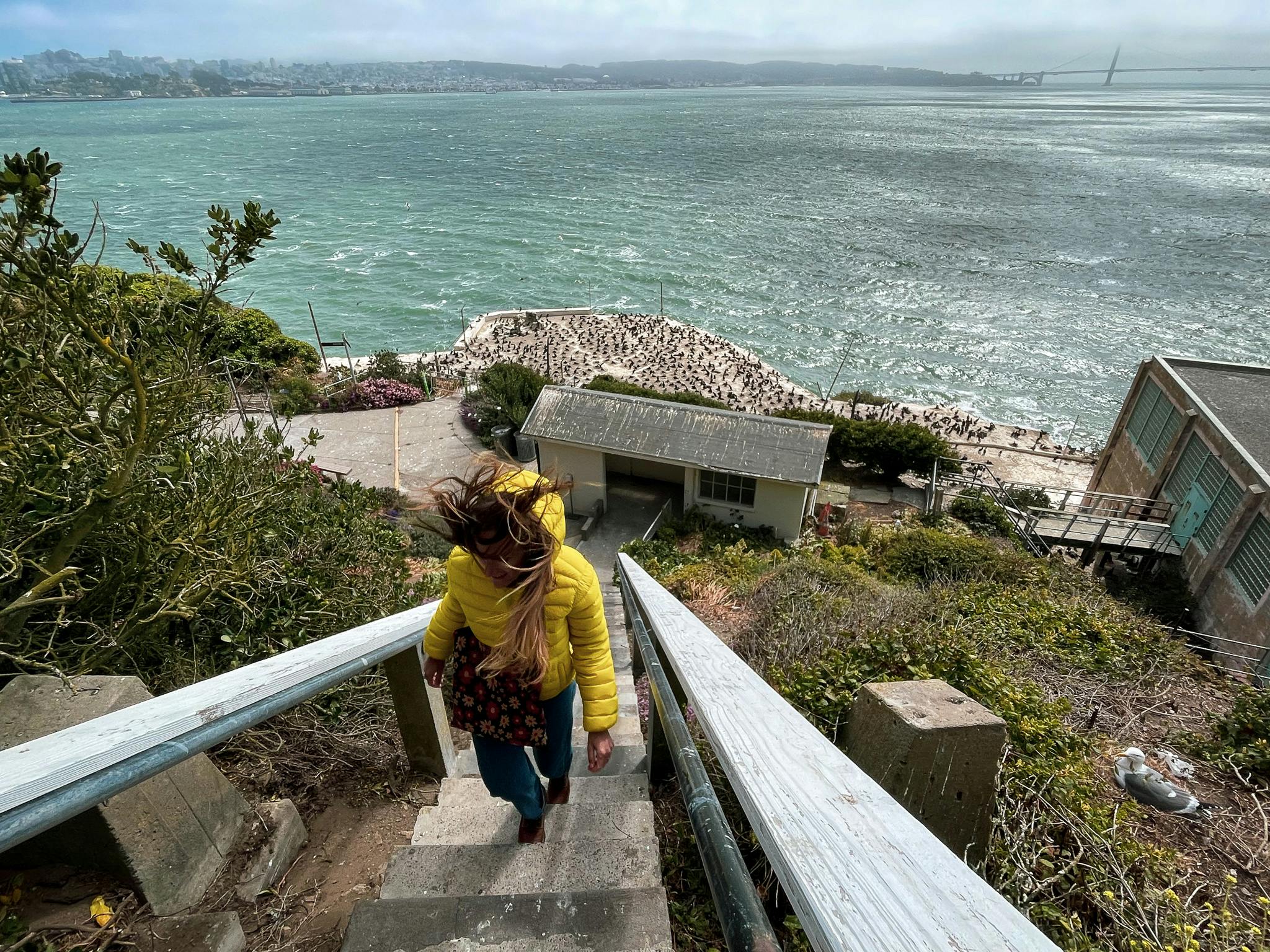 Woman hiking up stairs at Alcatraz Island
