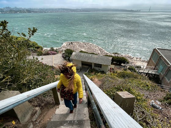 Woman hiking up stairs at Alcatraz Island