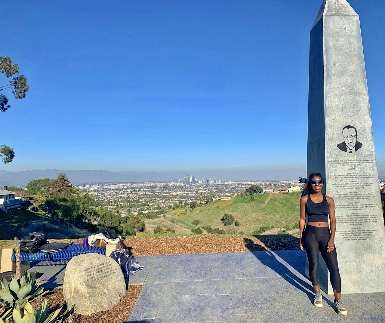 Woman standing at the obelisk at the Martin Luther King Jr. Memorial Tree Grove 