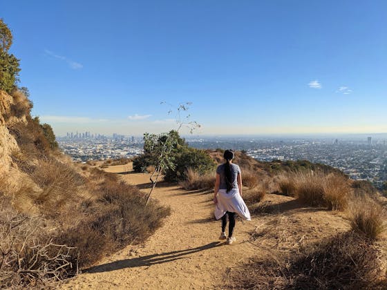 Woman hiking on the trail at Trebek Open Space in Los Angeles County 