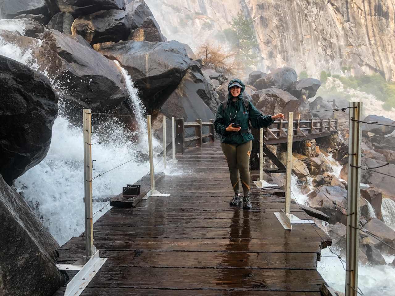 Woman on bridge at Wapama Falls in Hetch Hetchy Yosemite