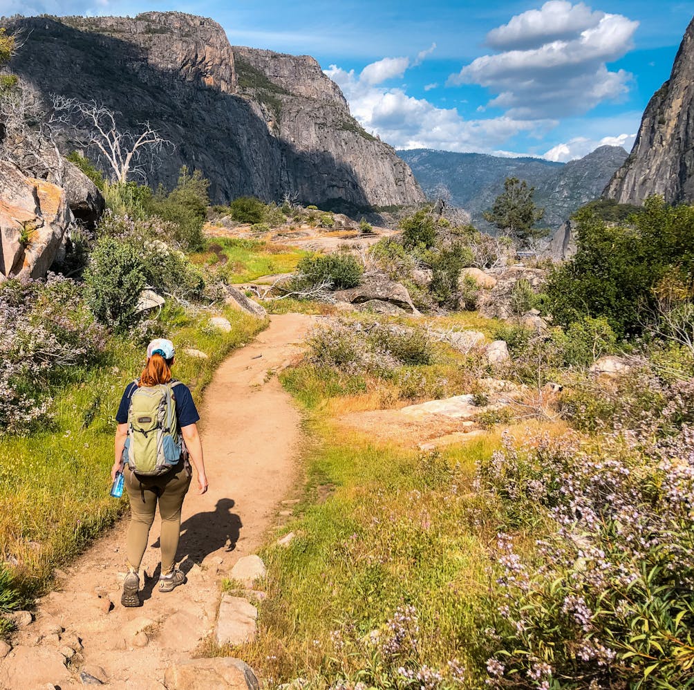 Woman hiking along a trail in Yosemite
