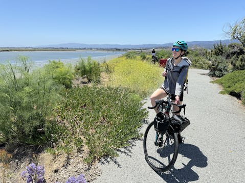 Woman taking a photo on a bike path