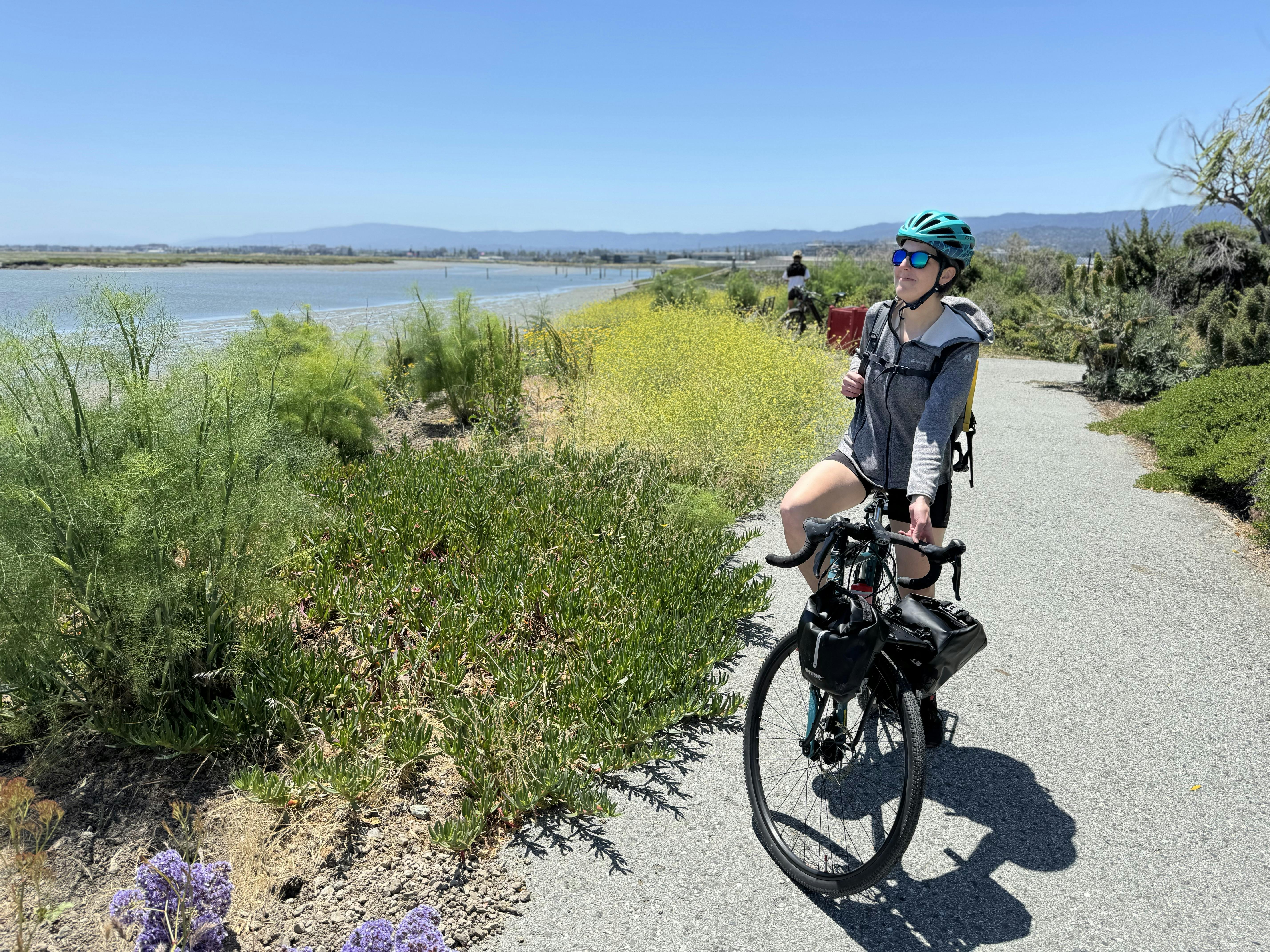 Woman taking a photo on a bike path