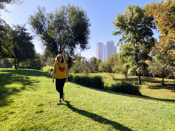 Woman on grassy lawn at Vista Hermosa Park in Echo Park Los Angeles