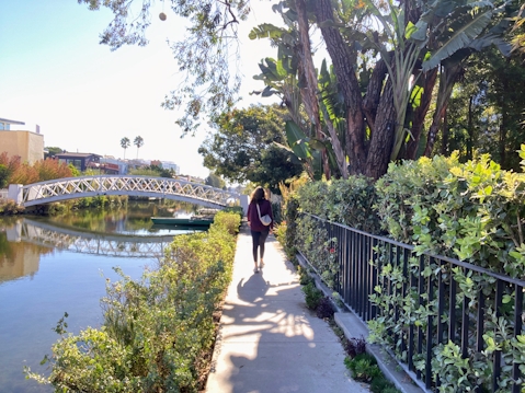 Woman walking in the Venice Canals of Los Angeles County