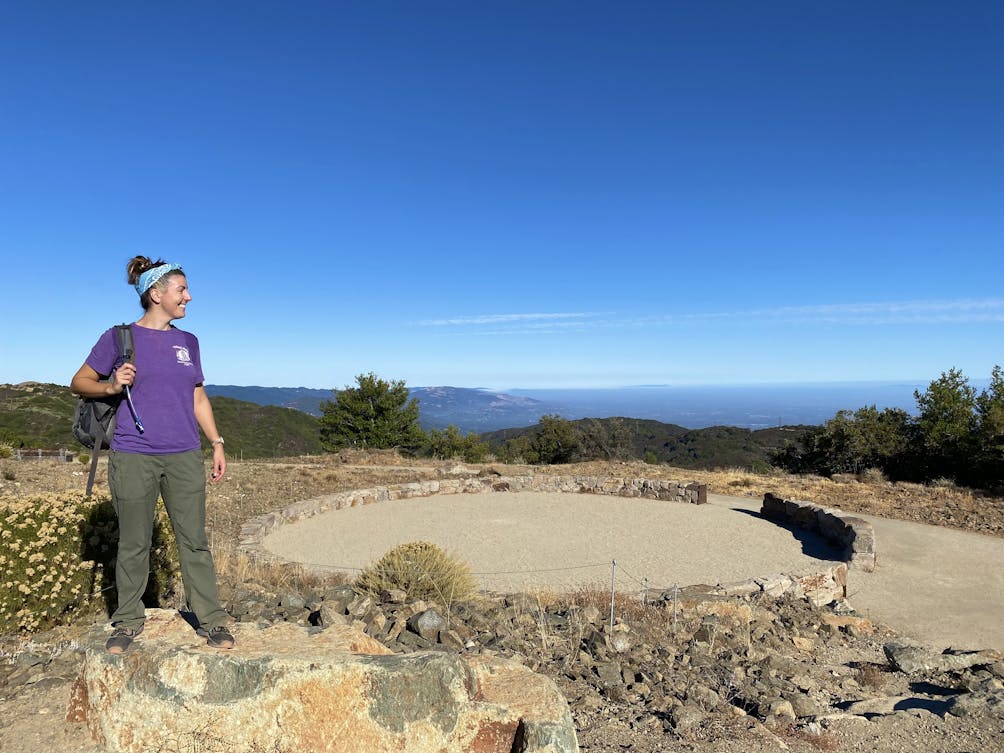 HIker at the Ceremonial Circle at the summit of Mount Umunhum in the Santa Cruz Mountains South Bay 