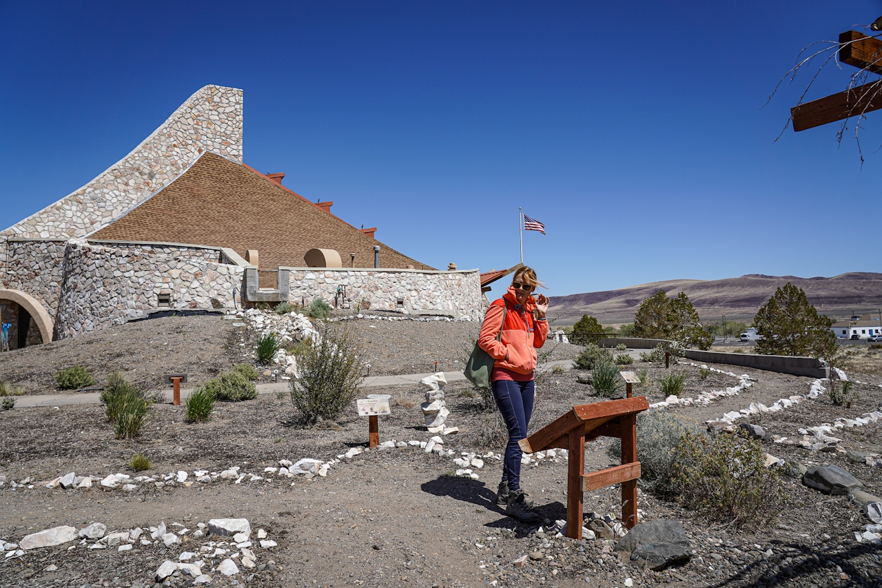 A woman is walking a pathway towards Pyramid Lake Museum and Visitor Center in Nevada