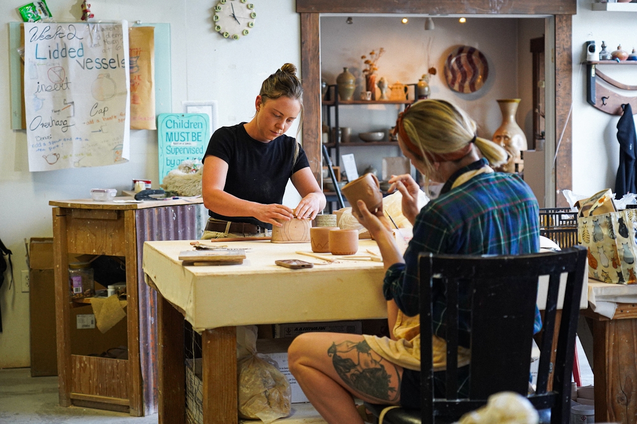 Two women working on pottery inside the Wedge Ceramic Studios along Reno's Dickerson Road