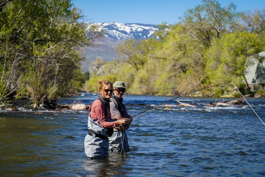 Two people fly fishing on the Truckee River with guides from Reno Fly Shop