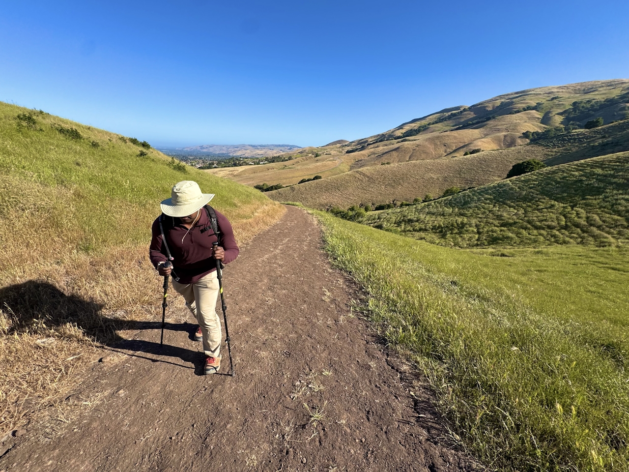 A woman hiking up the trail to reach Mission Peak in the San Francisco Bay Area