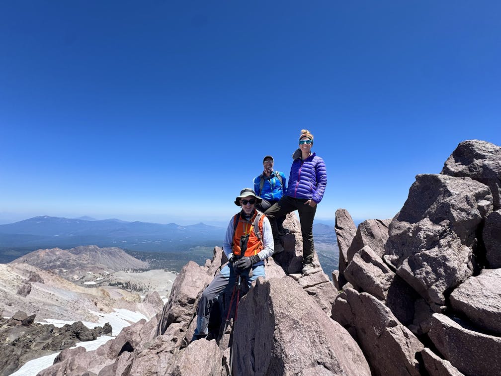 Hikers stand atop Lassen Peak in Lassen Volcanic National Park