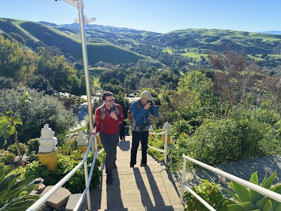 A man takes a break at a temple spot on a hike at Dragon Mountain in Milptas