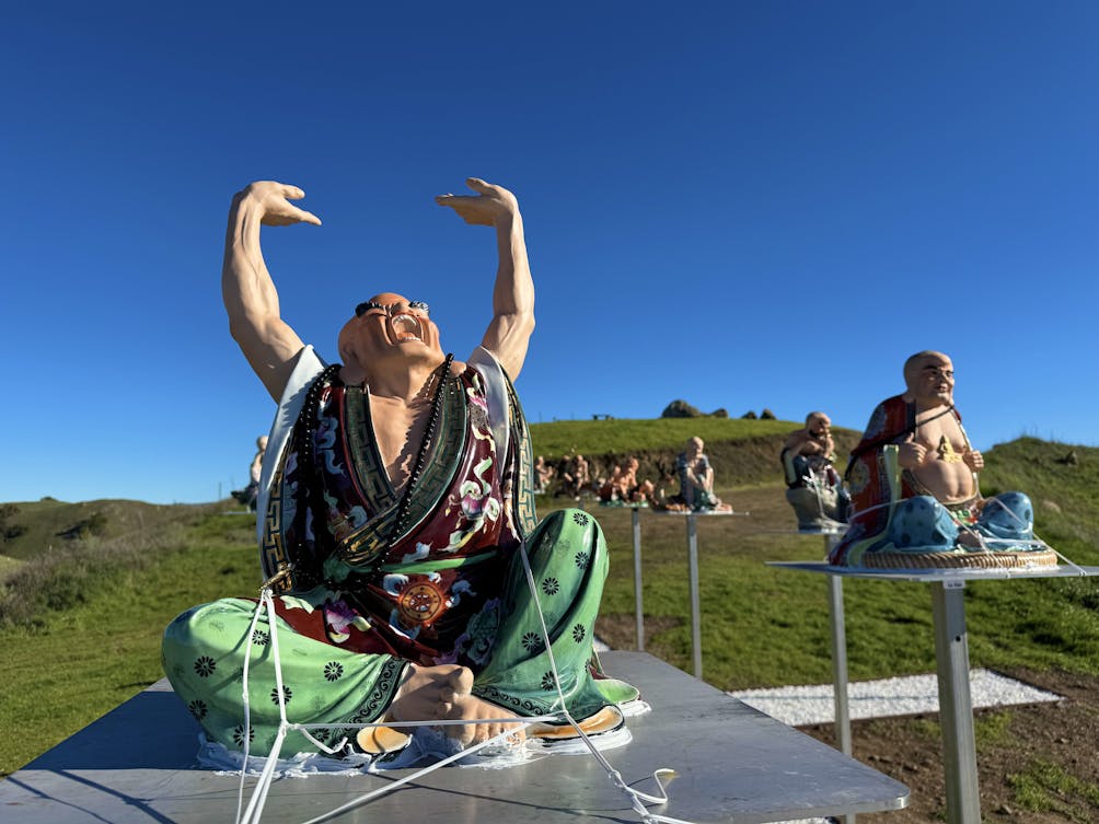 Happy buddha statues are on display at the top of the hill at Dragon Mountain in Milpitas
