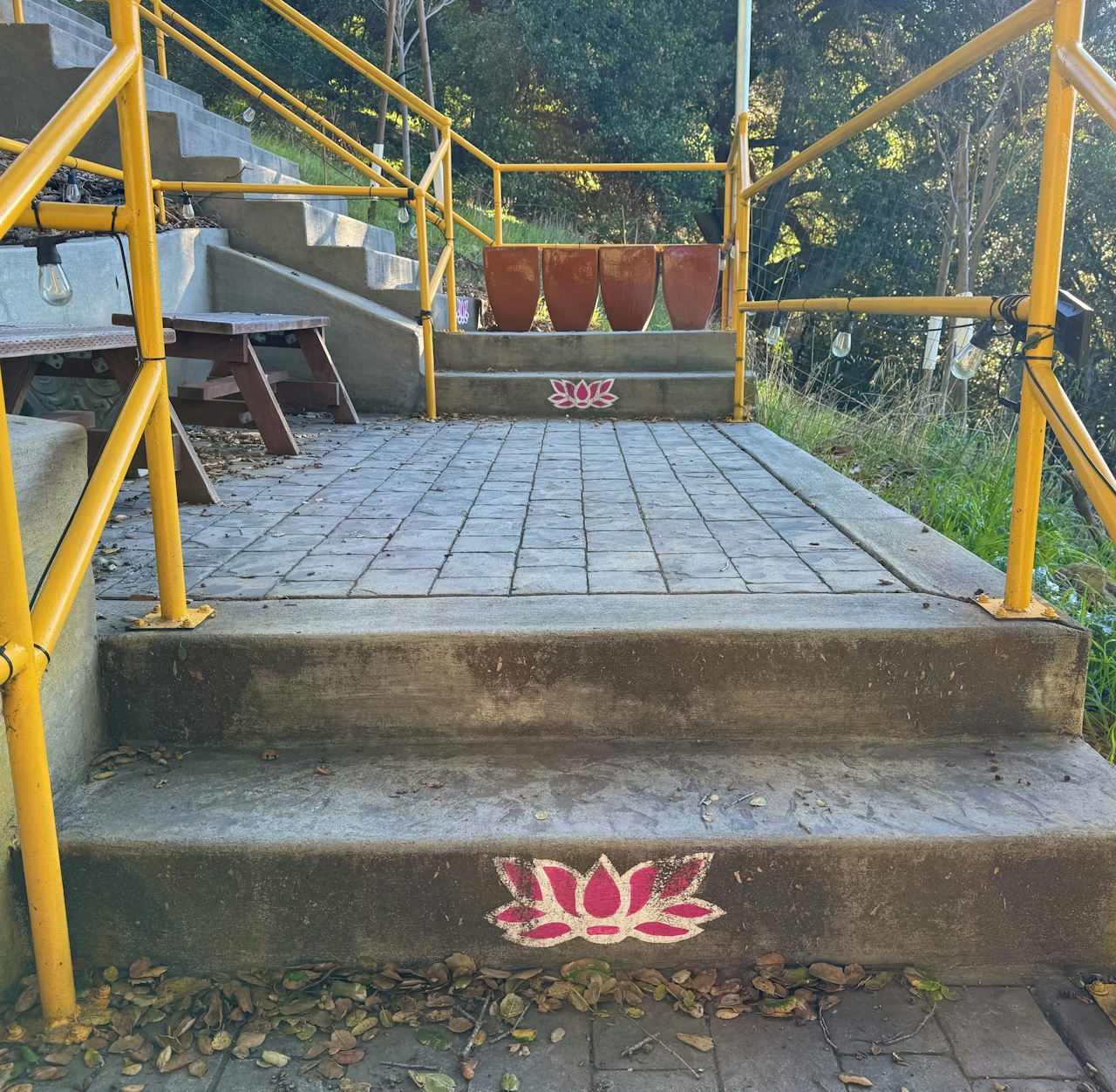 Pink flowers on the steps of the "Stairway to Heaven" at Dragon Mountain Park in Milpitas