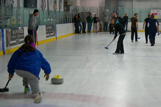 People on ice learning to curl at Hollywood Curling 