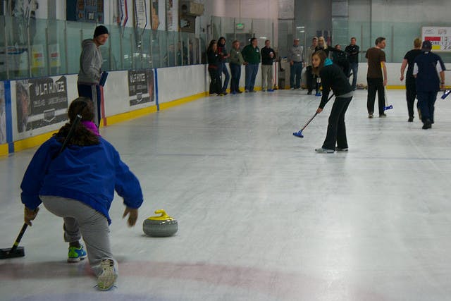 People on ice learning to curl at Hollywood Curling 