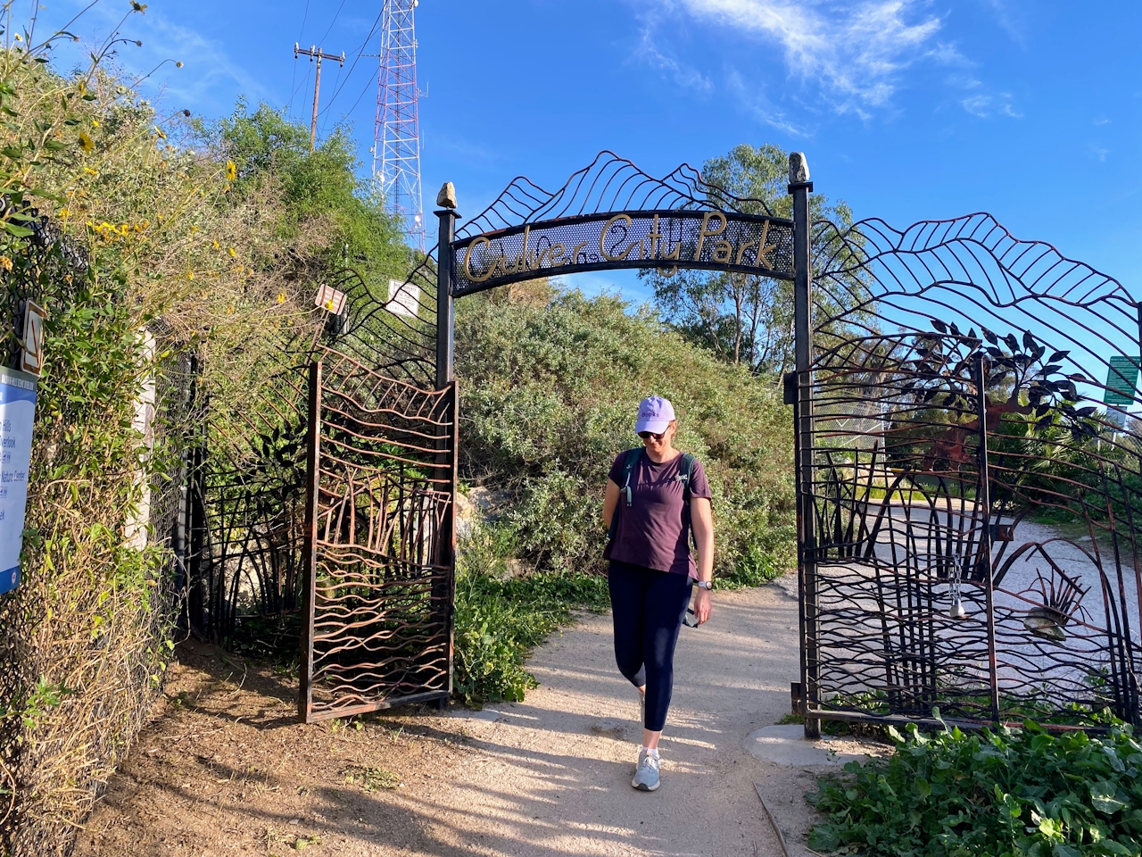 A woman passes through a gate for the Stoneview Nature Center 