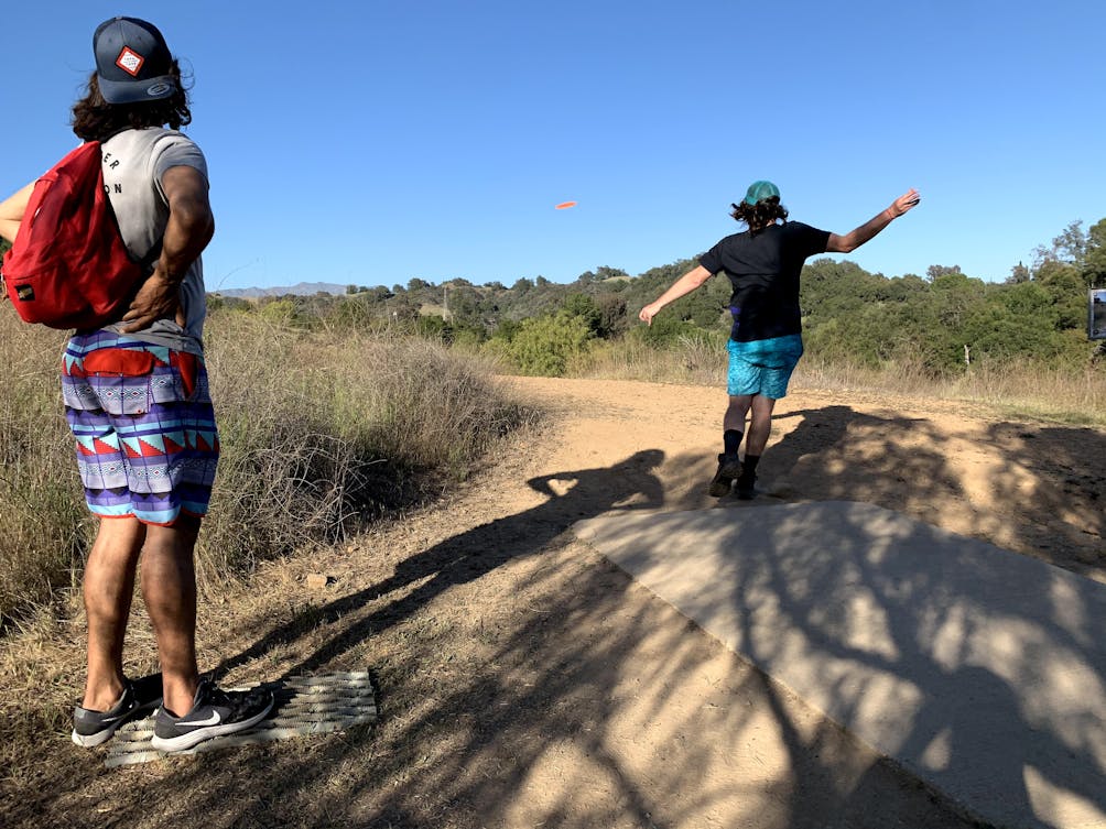 Friends playing disc golf at Coyote Point Disco Golf Course at Lake Casitas Recreation Area near Ventura 