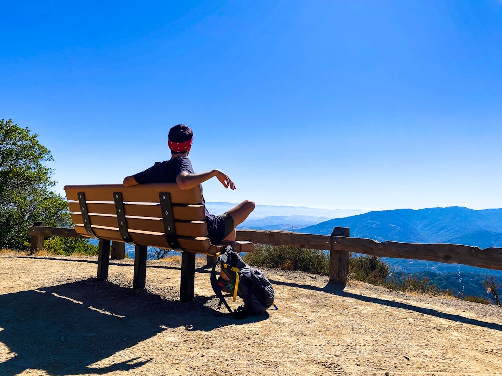 Person taking a break to take in the view at El Sereno Open Space Preserve 