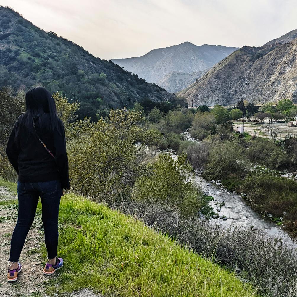 Hiker looking at the San Gabriel River in Azusa River Wilderness Park 