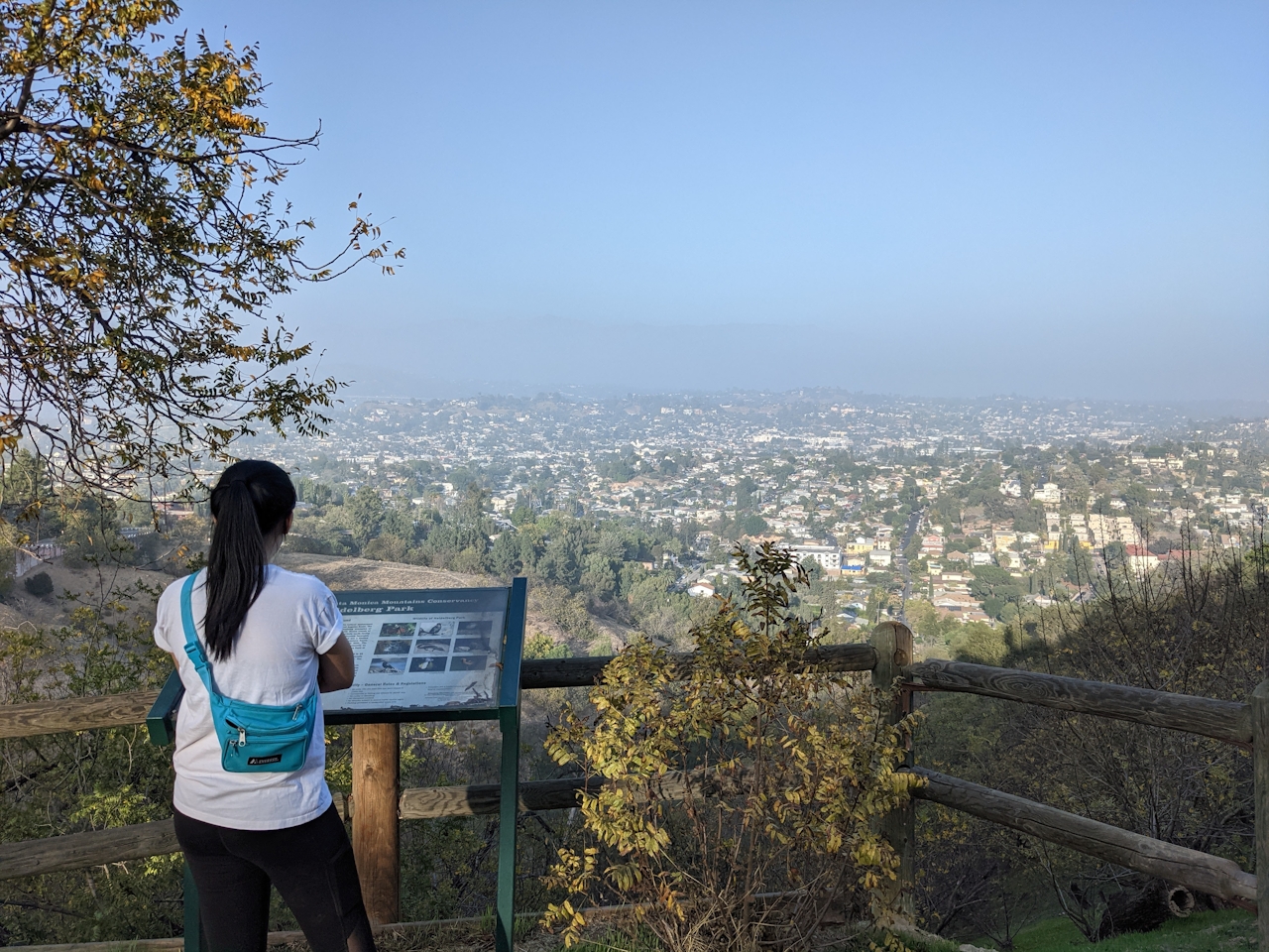 Woman at a viewpoint in Moon Canyon on an urban hike in Los Angeles 