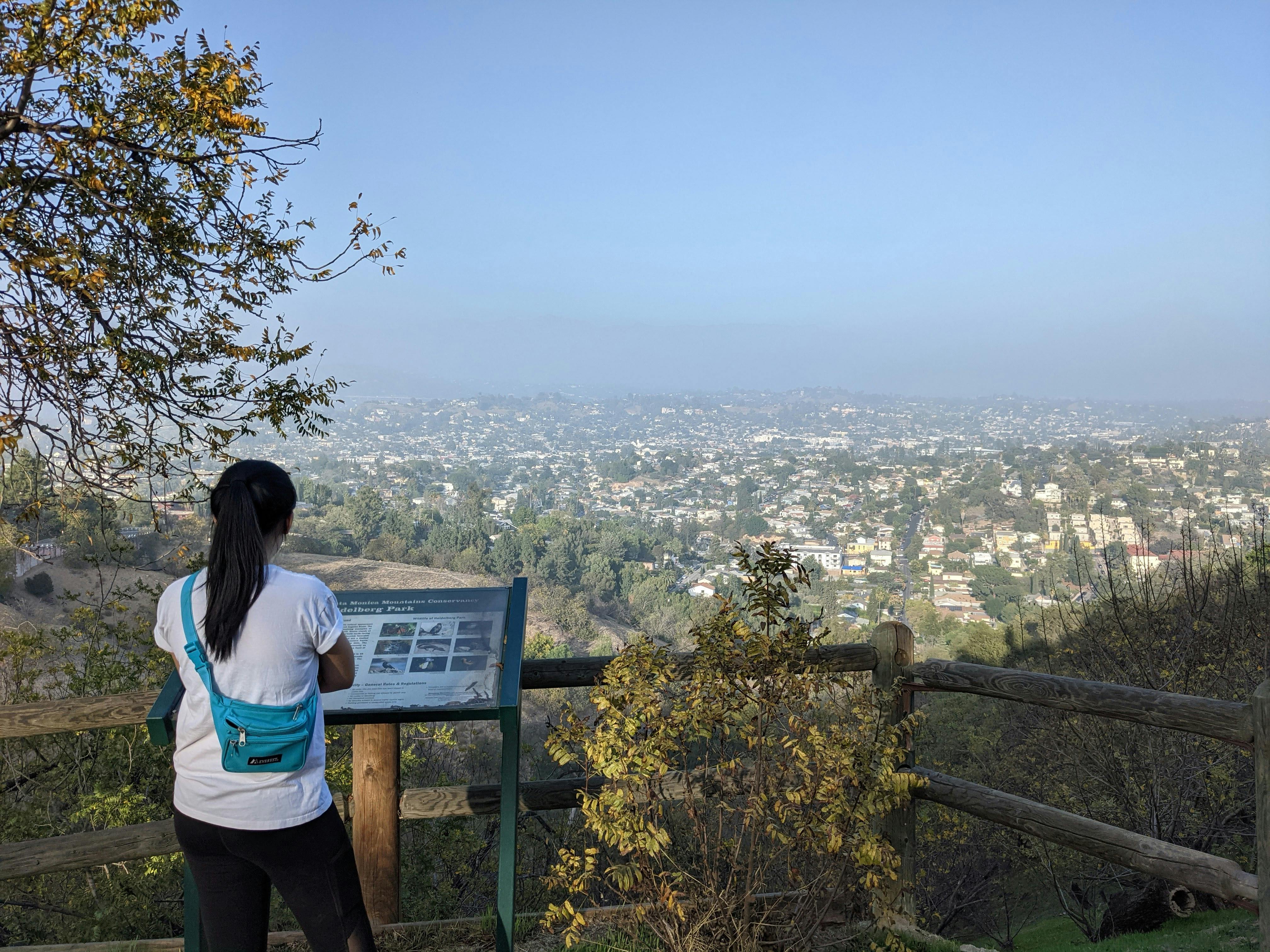 Woman at a viewpoint in Moon Canyon on an urban hike in Los Angeles 