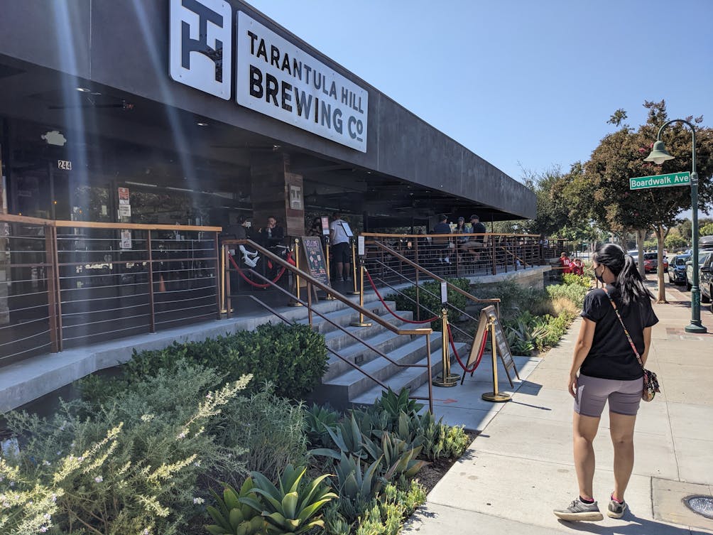Woman standing outside of Tarantula Brewing Co. in Thousand Oaks California 