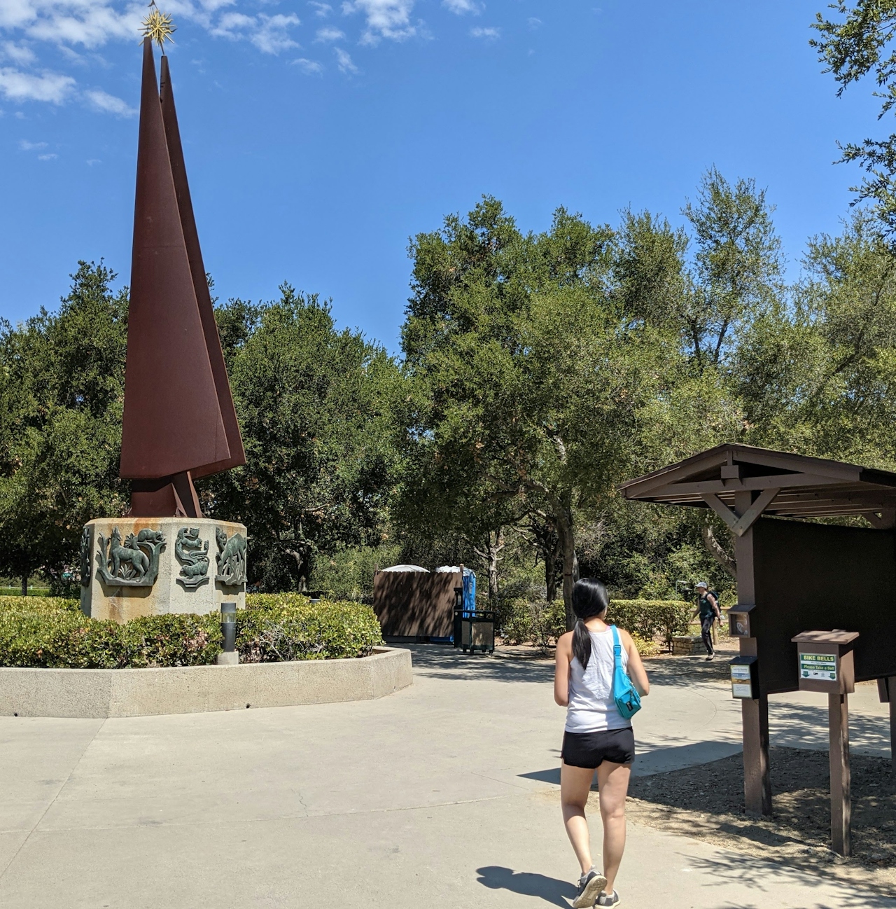 Woman hiking through the entrance to Whiting Ranch Wilderness Park in Orange County 