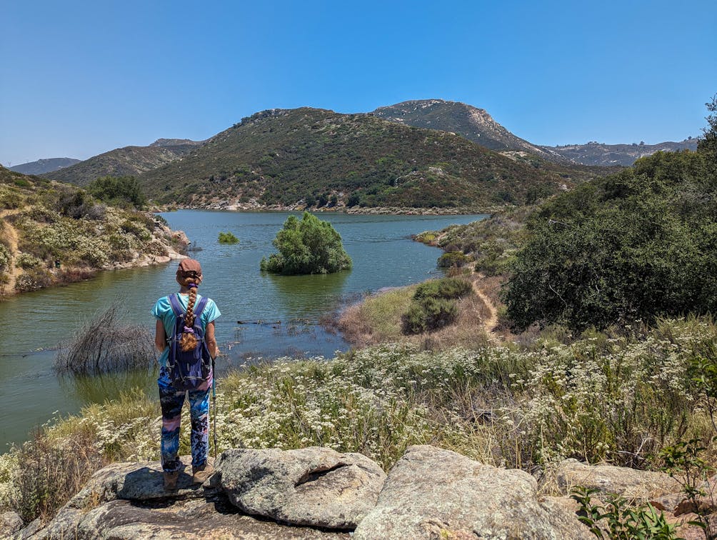 Hiker staring out at Loveland Reservoir in Alpine San Diego County 