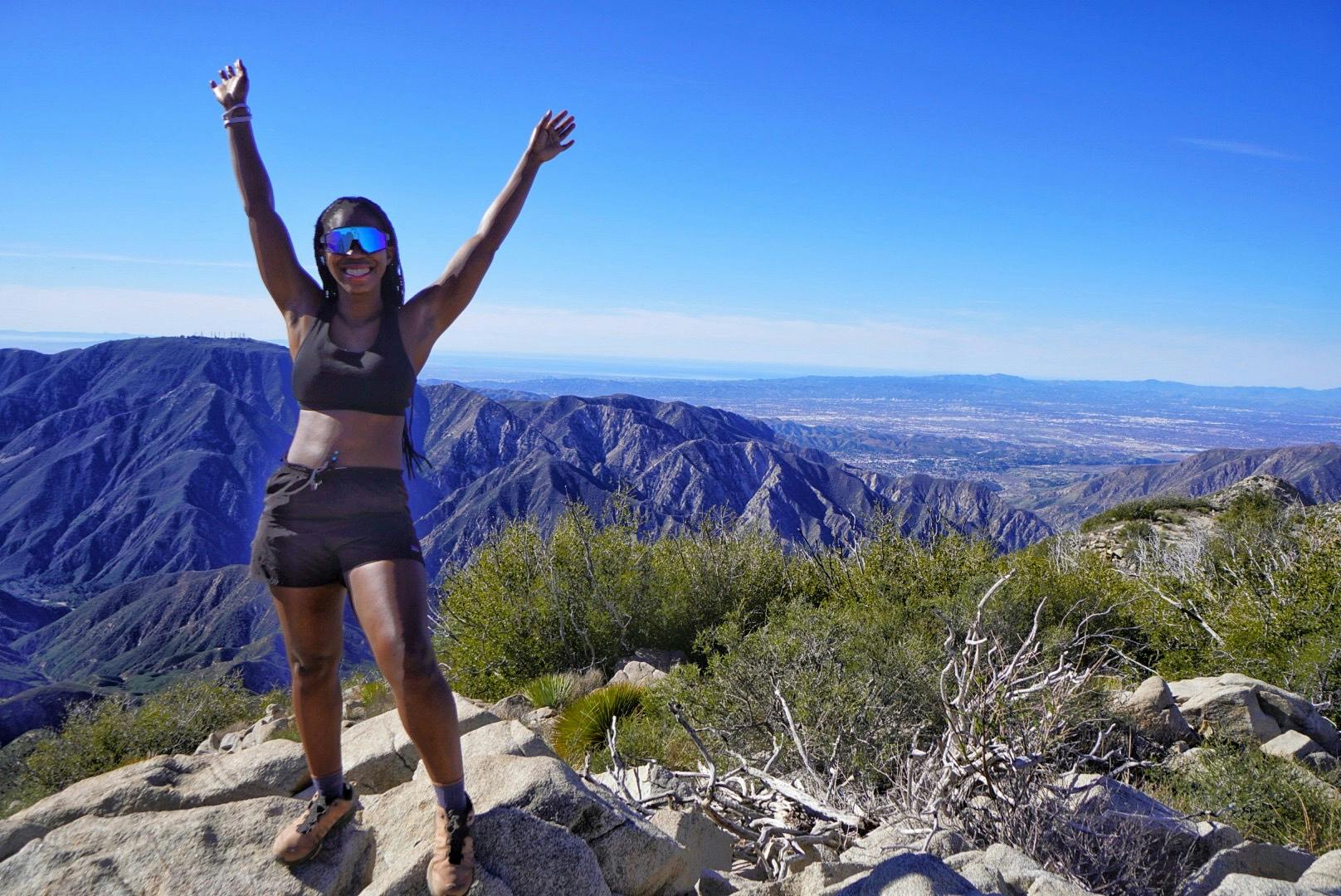 Hiker celebrating at Condor Peak in the San Gabriel Mountains Los Angeles County 