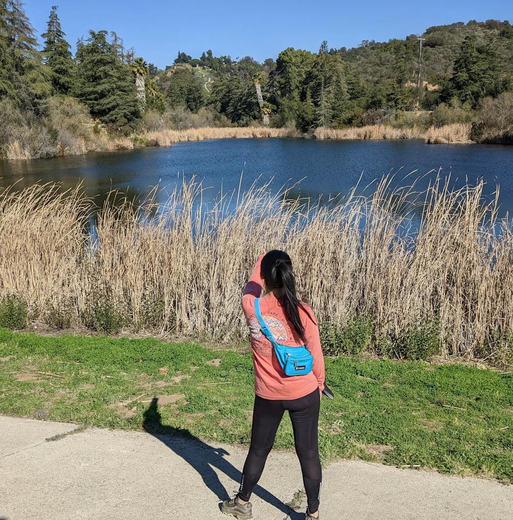 Woman looking out at the water at Franklin Canyon Park in Los Angeles