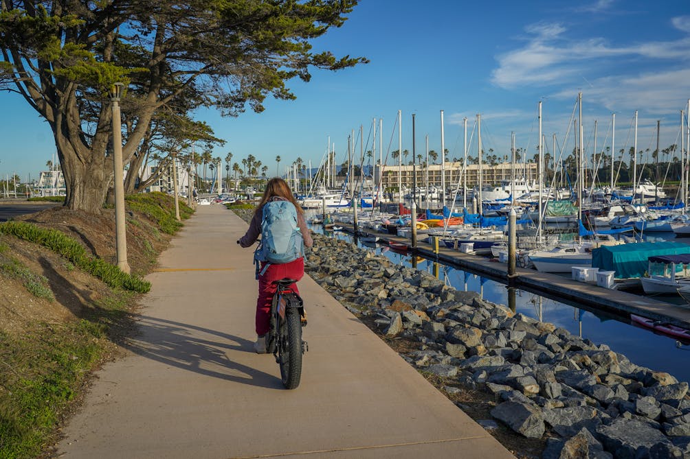 woman riding an e-bike at Channel Islands Harbor in Oxnard 