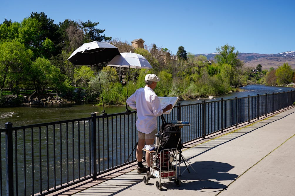 Painter standing at Truckee River in Reno 