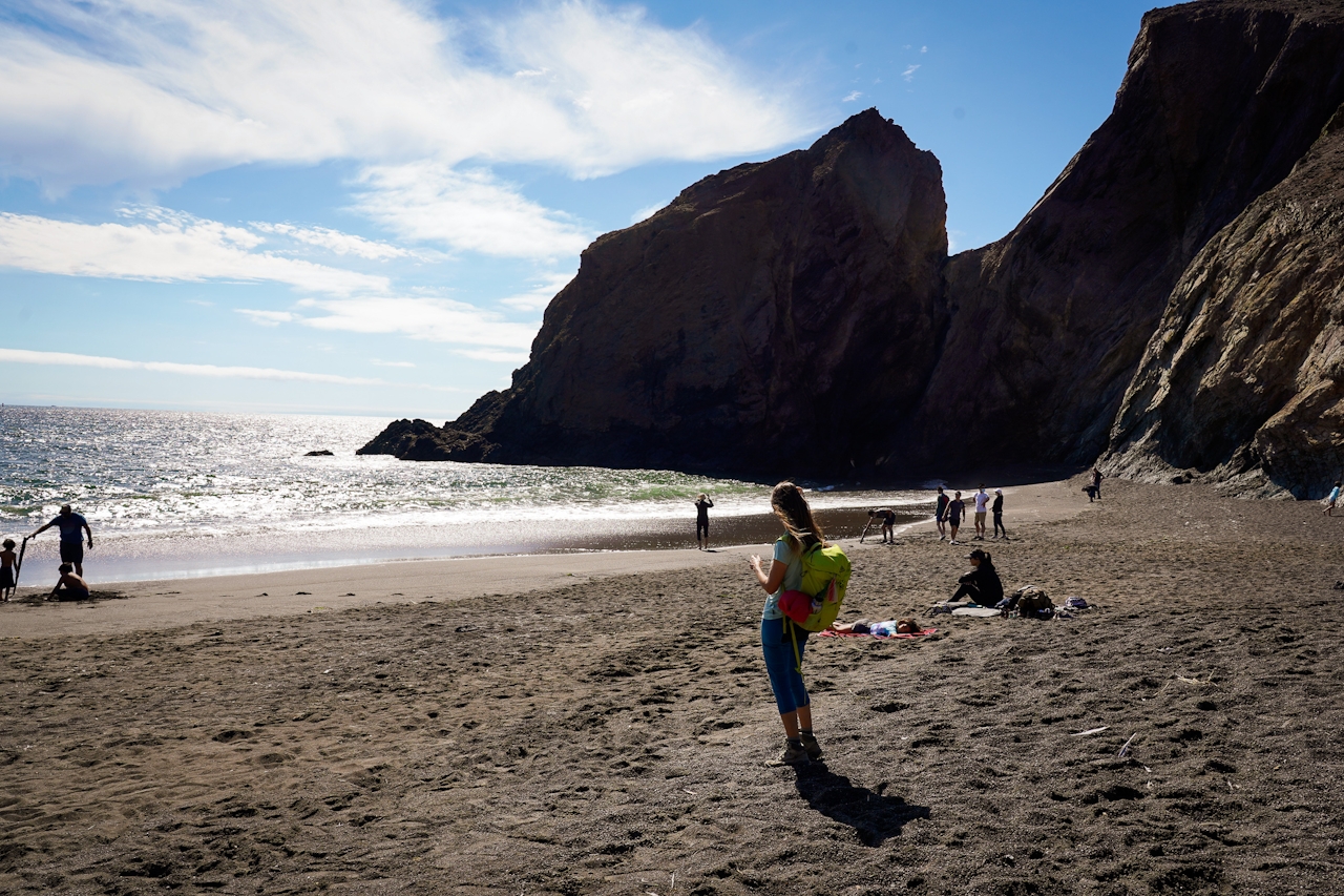 Woman on Tennessee Cove beach in the Marin Headlands 