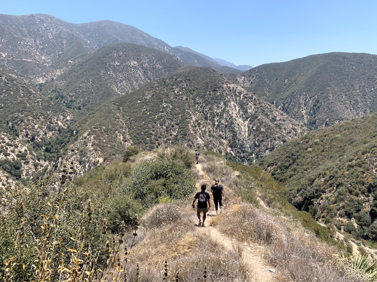 Hikers descending into a canyon in the Angeles National Forest Southern California 