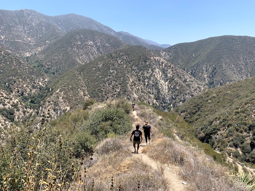 Hikers descending into a canyon in the Angeles National Forest Southern California 