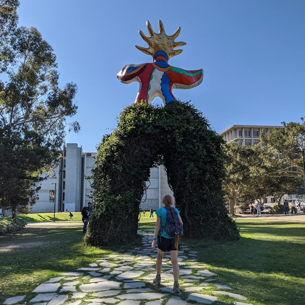 Woman looking at the Sun God statue at University of California, San Diego 