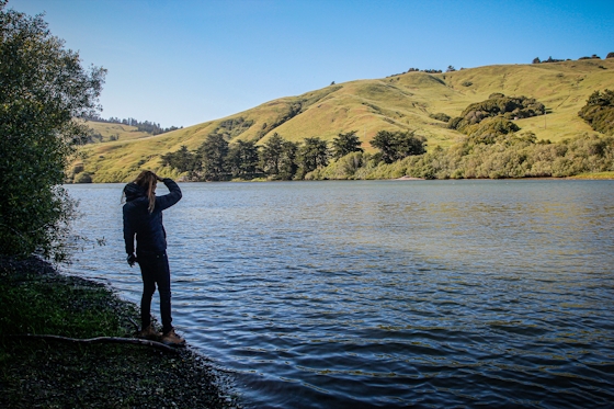 woman looking at Russian River willow camp