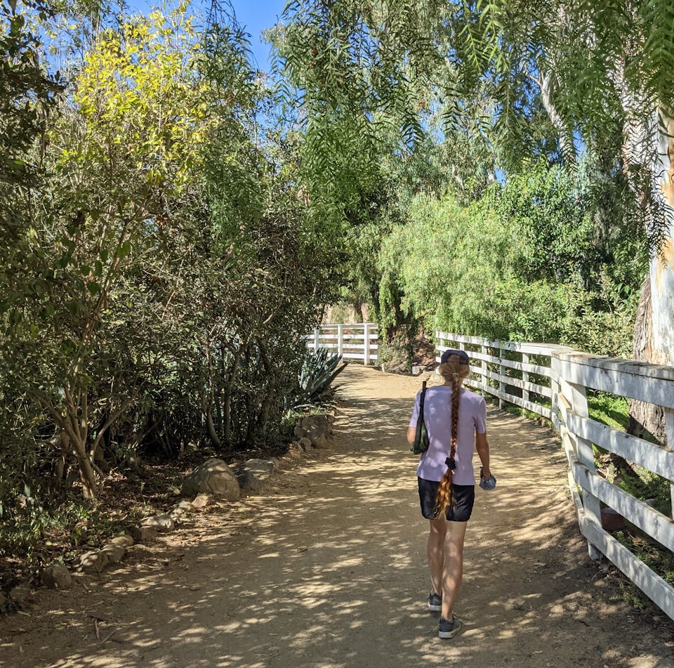 Woman hiking a trail at Leo Carillo Ranch Historic Park 