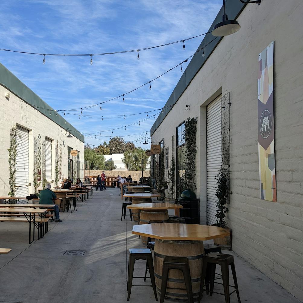 outdoor tables amid string lights at The Alley Moorpark in Simi Valley 